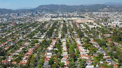Aerial pullback shot of Los Angeles residence, homes, Hollywood, green trees Stock Footage 308101092