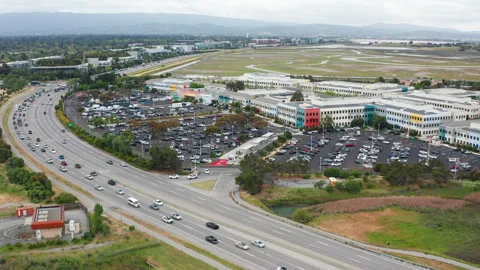 Aerial pullback shot of Menlo Park tech industry buildings and offices Stock Footage 308251146