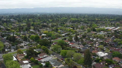 Aerial pullback shot of Menlo Park suburban homes, trees in Bay Area Stock Footage 308253662