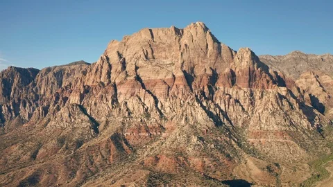 Aerial pullback shot of Mount Wilson mountain range and peaks in Red Rock Canyon Stock Footage 122909805