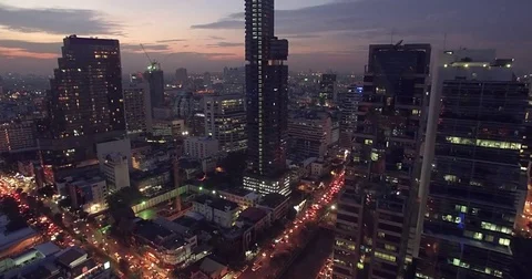 Aerial Pullback Shot Over Bangkok City Center at Dusk Stock Footage 75046690