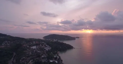 Aerial Pullback Shot of Patong and Tri Tra Beach at Sunset, Phuket Stock Footage 65966439