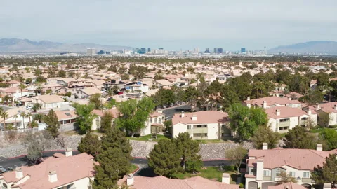 Aerial pullback shot of safe suburban area of Henderson Las Vegas with skyline Stock Footage 271310432