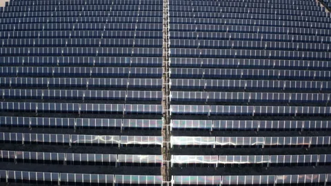 Aerial pullback shot of solar panel photovoltaic clean energy facility in Nevada Stock Footage 271281896