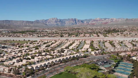 Aerial pullback shot of Summerlin, Las Vegas residence with Red Rock Canyon Stock Footage 271202742