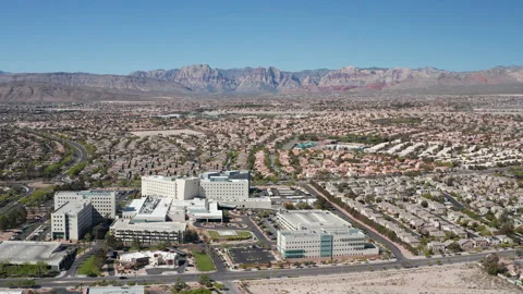 Aerial pullback shot of Summerlin Las Vegas community and commercial buildings Stock Footage 271304824