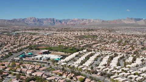 Aerial pullback shot of Summerlin residences and residential community in Vegas Stock Footage 271305009