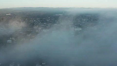 Aerial pullback shot in thick clouds and fog in Eureka California in Humboldt Stock Footage 200922191