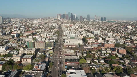 Aerial pullback shot of urban Los Angeles, car traffic, apartments, buildings Stock Footage 273756009