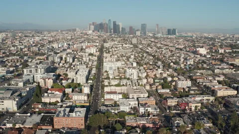 Aerial pullback shot of urban Los Angeles, Koreatown, cars, shops, buildings Stock Footage 273756650