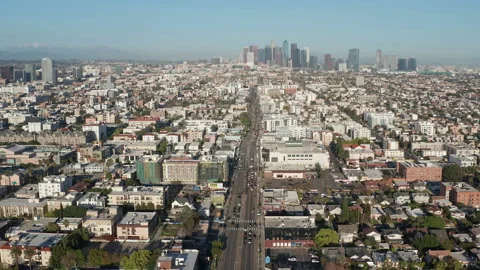 Aerial pullback shot of urban Los Angeles, Koreatown, cars, shops, apartments Stock Footage 273757117