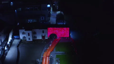 Aerial pullback from Spanish Art decorative light display at night Stock-Footage 299771928