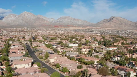 Aerial Pullback Summerlin Las Vegas neighborhood with Red Rock Canyon mountains Stock Footage 333117060