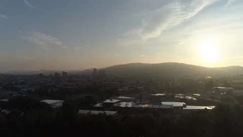 Aerial pullback of sunrise over Reading city. Video stock 102781545