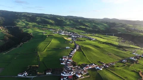 Aerial pullback at sunset over Achada freguesia in Nordeste in lush landscape Stock-Footage 306144465