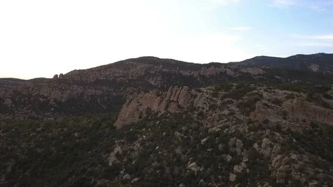 Aerial pullback of unique granite rock formations in desert mountains Stock Footage 113107038