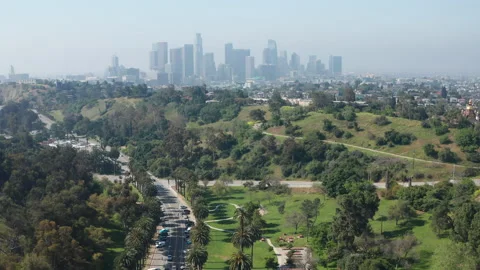 Aerial pullback view of beautiful Elysian Park and Los Angeles downtown Stock Footage 273838234