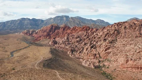 Aerial pullback view of colorful Calico sandstone cliffs in Red Rock Canyon Stock Footage 122914715