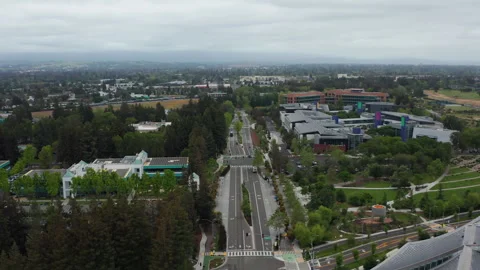 Aerial pullback view of Google and tech industry buildings in Mountain View Stock Footage 308205206