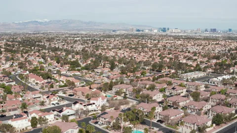 Aerial pullback view of Henderson Las Vegas suburban area with city skyline Stock Footage 271307821