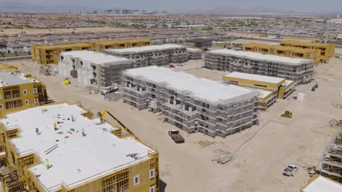 Aerial Pullback View of Las Vegas Residential Construction Site and City Skyline Stock-Footage 333658878