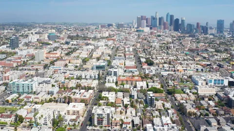 Aerial pullback view of Los Angeles downtown Koreatown urban homes and buildings Stock Footage 308098864