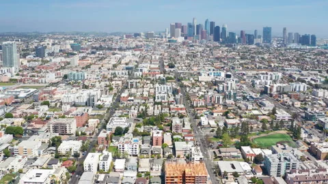 Aerial pullback view of Los Angeles downtown urban homes apartments buildings Stock Footage 308098865