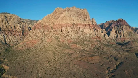 Aerial pullback view of Red Rock Canyon Mountains, Wilson, Rainbow, First Creek Stock Footage 122908497
