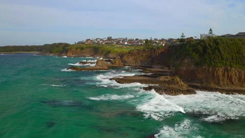 Aerial Pullback view of Sea Stacks With Splashing Waves At Cathedral Rocks Video stock 157474766