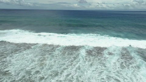 Aerial Pullback of Whitewash Spreading Over Shallow Fringing Reef, Rarotonga Stock Footage 299284481