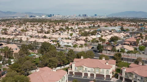 Aerial pullback wide shot of Henderson Las Vegas residential community skyline Stock Footage 271311153