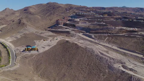 Aerial Pullback Wide Shot Hillside Construction Cranes in Henderson Las Vegas Stock Footage 333724511
