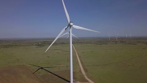 Aerial pullback of wind turbines in a row Stock-Footage 112869717