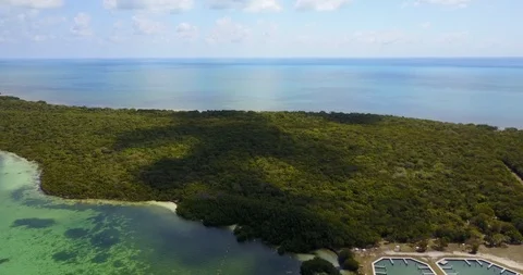 AERIAL: pulling away and tilting down to both hide and reveal the dock and Stock Footage 100641994