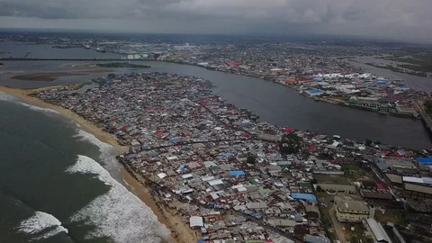Aerial Pulling Away From Massive Slum on Beach Stock-Footage 101626635