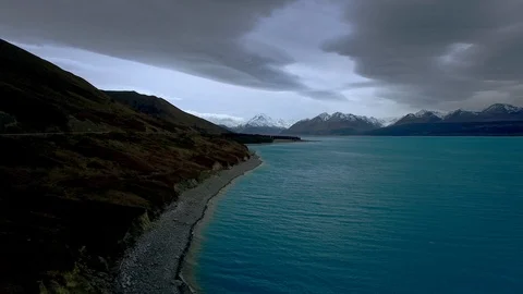 Aerial Pulling Away From Mount Cook and Turquoise Water Lake Stock Footage 101264911