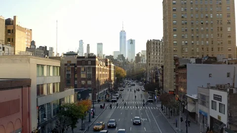 Aerial pulling back 6th ave traffic Freedom Tower Manhattan New York City NYC 動画素材 119555625