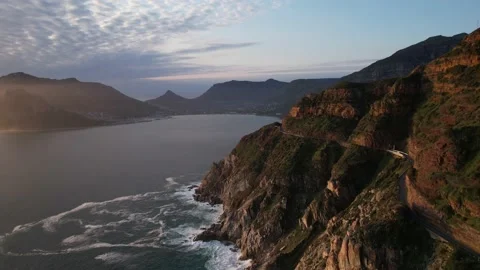 Aerial Pulling Back Along Stunning Cliffside Road Toward Cape Town Stock Footage 230934848