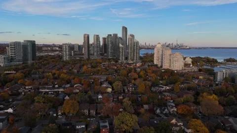 Aerial pulling back from condos in Toronto, autumn trees and neighborhood. Stock Footage 254307472