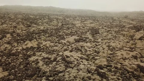 Aerial Pulling Back Over Lava Field On Cloudy Creepy Day 스톡 동영상 125200533