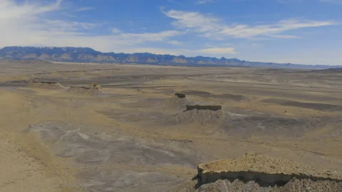 Aerial-Pulling back from series of small desert mesas Stock-Footage 157128622