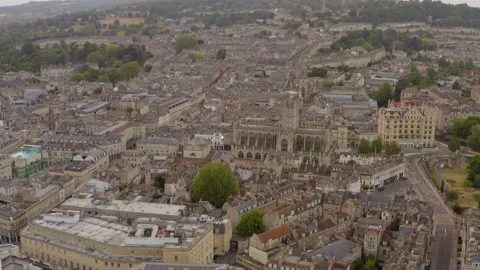 Aerial pulling out from Bath Abbey to wide shot of Bath in England United Stock Footage 144782590