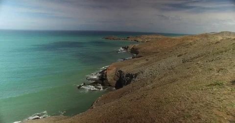 Aerial pulling out from the coast towards the water of La Guajira, Colombia 스톡 동영상 72395855