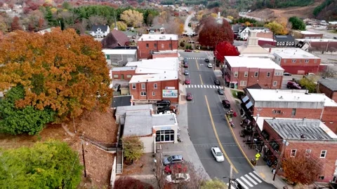 Aerial pullout over fall foliage in burnsville nc, north carolina Stock Footage 220840533