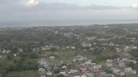 Aerial pulls back from Caribbean Sea over villages in the south of Trinidad 스톡 동영상 261906310