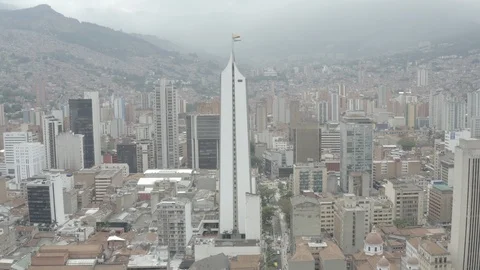 Aerial pulls back from the Coletejer tower in downtown Medellin, Colombia Stock-Footage 105783895