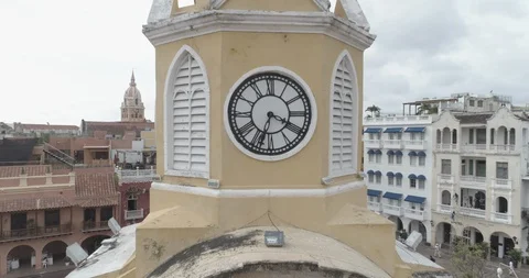Aerial pulls back from CU on the clockface of the Torre de Reloj in Cartagena 스톡 동영상 96010580