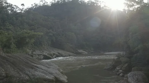 Aerial pulls back low under the bridge of Mandiyaco Canyon with lens flare 스톡 동영상 104841041