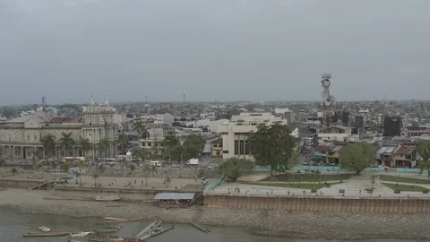 Aerial pulls back from main church on boardwalk to reveal Quibdo, Choco Stock-Footage 106374560