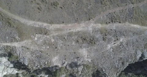 Aerial pulls back from overhead the Suesca rocks and tilts up to reveal Video stock 82373763